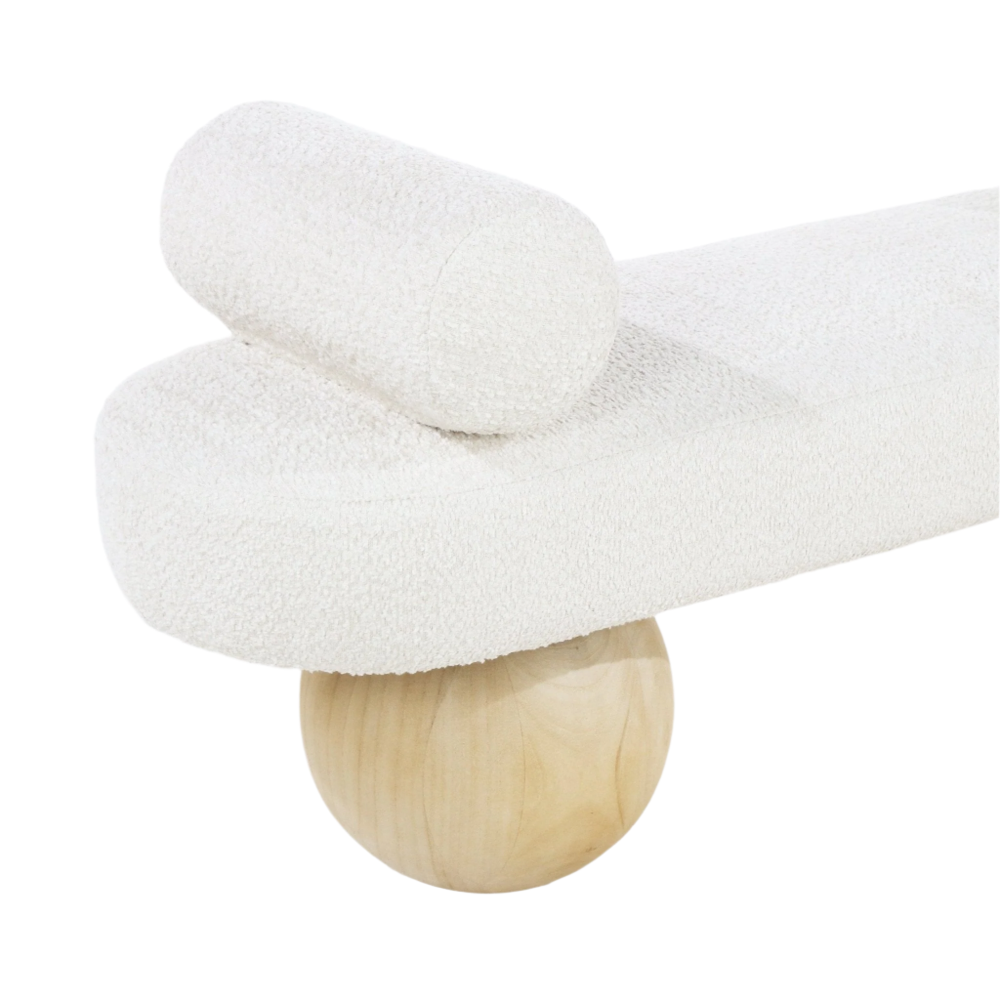 Close-up of a white boucle-upholstered end-of-bed bench showing a cylindrical bolster cushion and a rounded natural wood ball leg.
