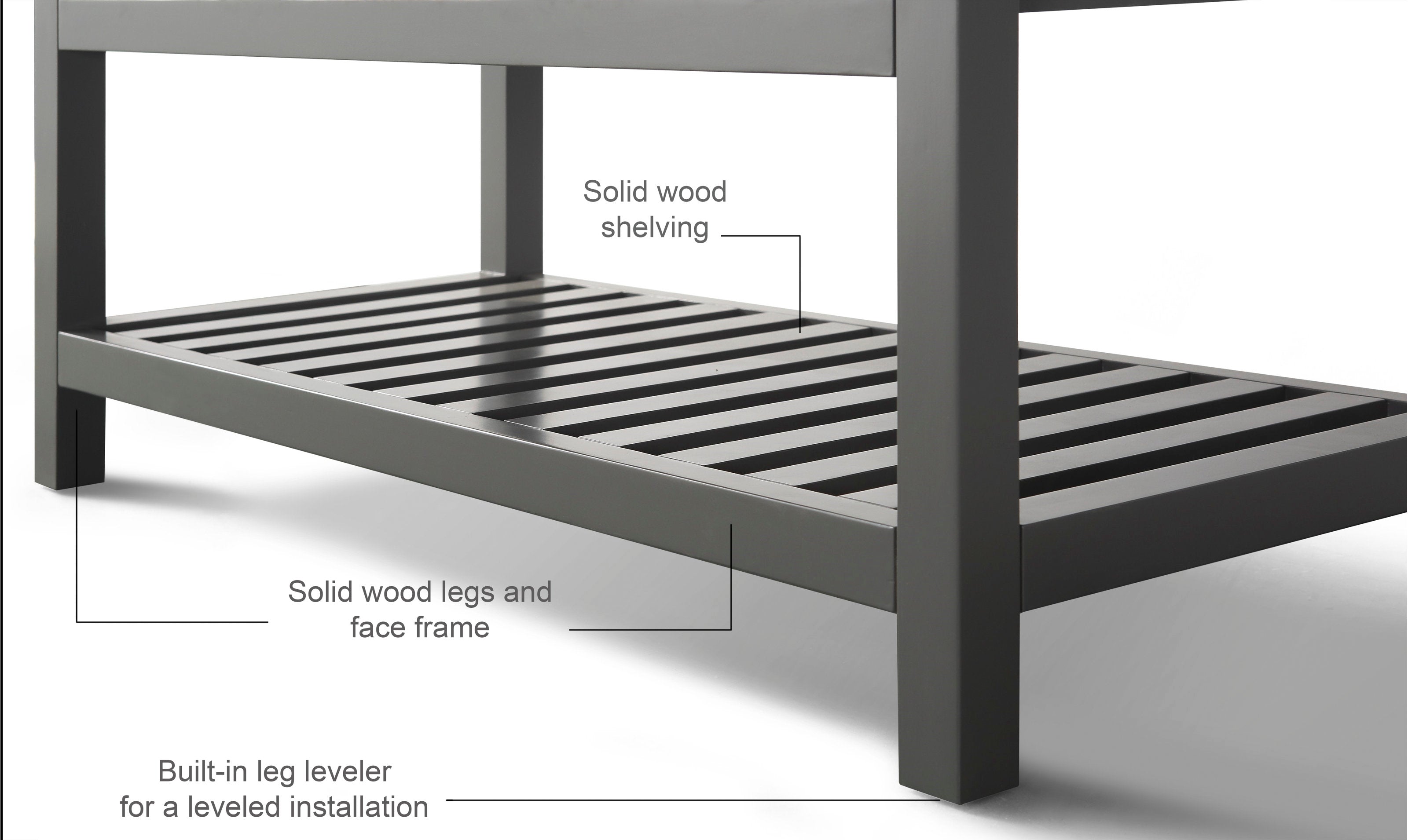 Close-up of a modern stone-colored bathroom vanity lower section showing an open slatted solid wood shelf, square solid wood legs and face frame, and a built-in leg leveler for a leveled installation.