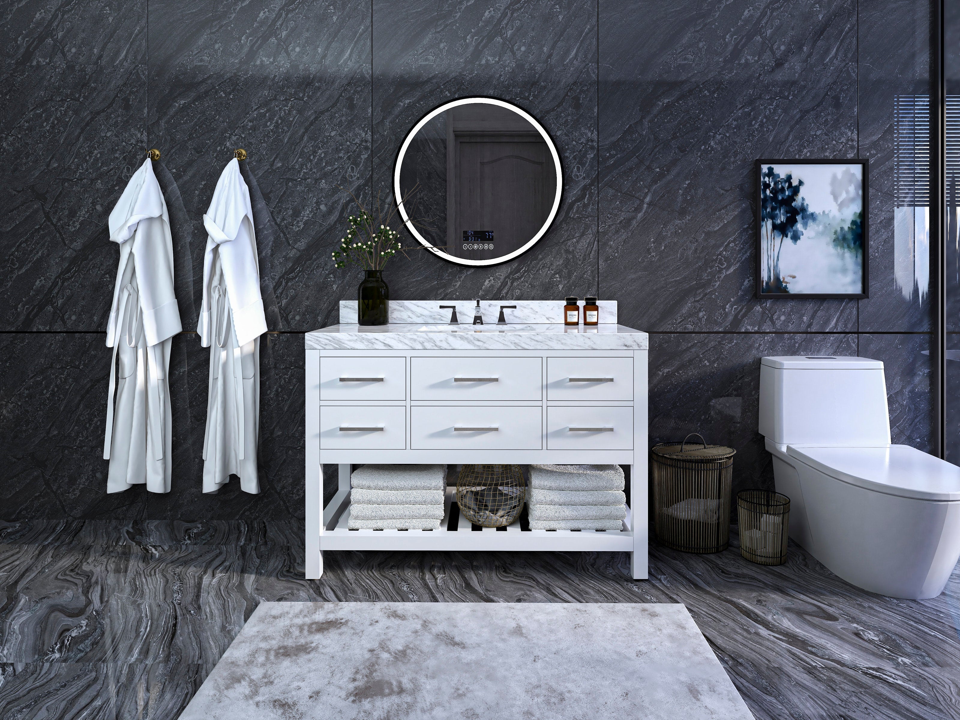 Modern 48-inch white solid wood single-sink vanity with a marble top and brushed metal handles, round illuminated mirror above, open lower shelf stacked with towels, decorative vase and a toilet against dark stone walls.
