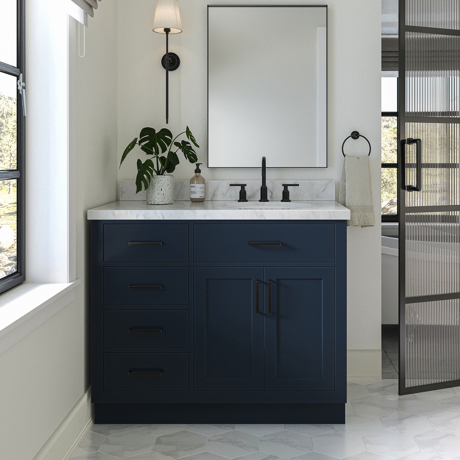 Modern 43-inch solid wood single-sink bathroom vanity with a stone marble top, deep navy painted base, matte black faucet and hardware, soft-close drawers and cabinet, mirror and potted plant on the countertop.