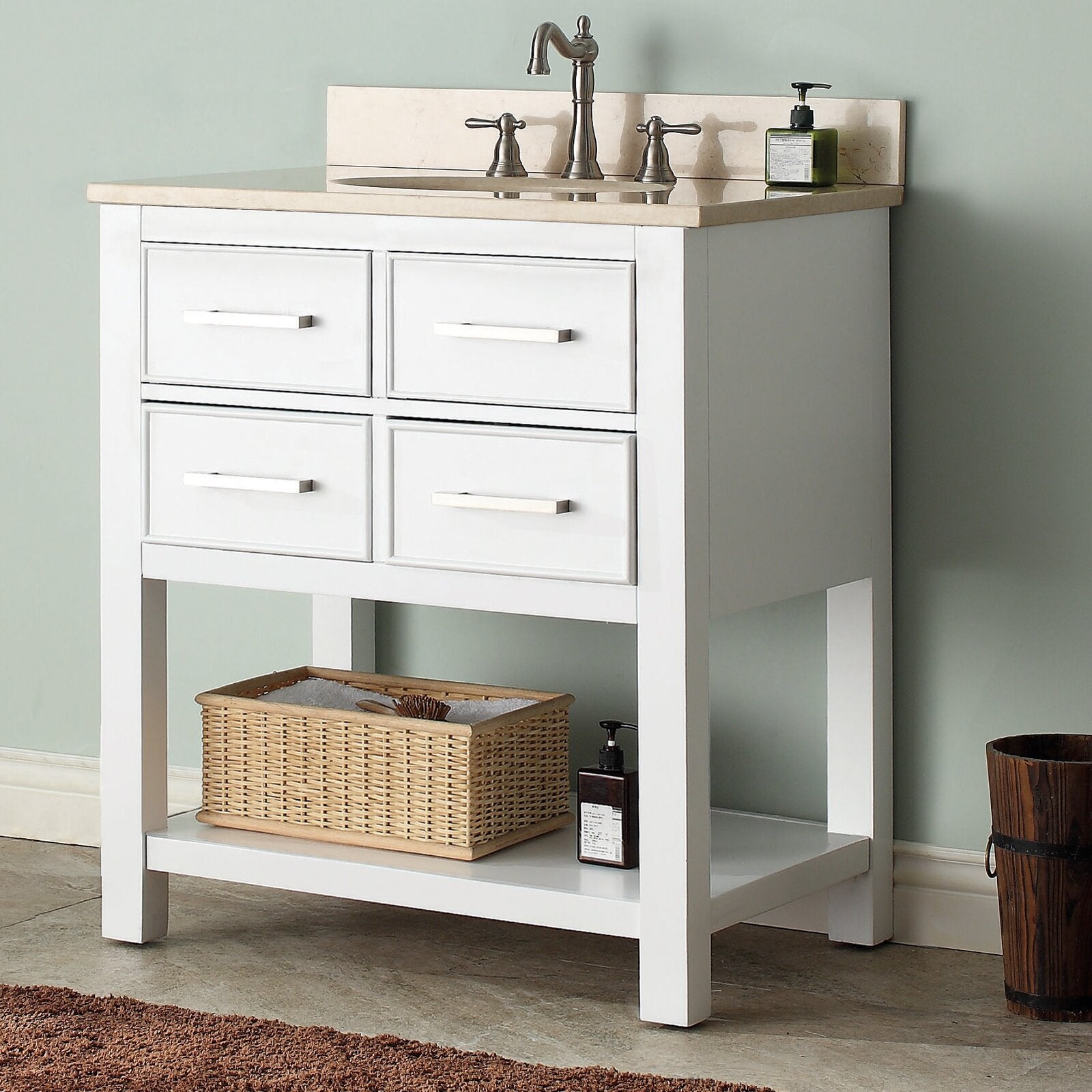 31-inch modern solid wood bathroom vanity in stone color with beige stone countertop and undermount sink, brushed-nickel faucet, four drawer fronts and lower open shelf holding a wicker basket and soap dispenser.