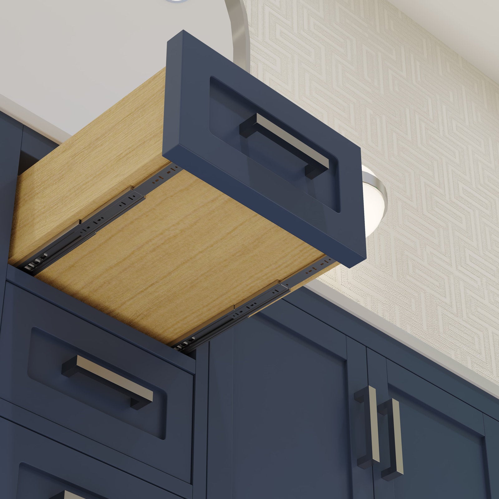 Close-up of a navy blue modern bathroom vanity drawer showing a solid wood interior, metal rectangular pull handle and soft-close metal drawer slides.