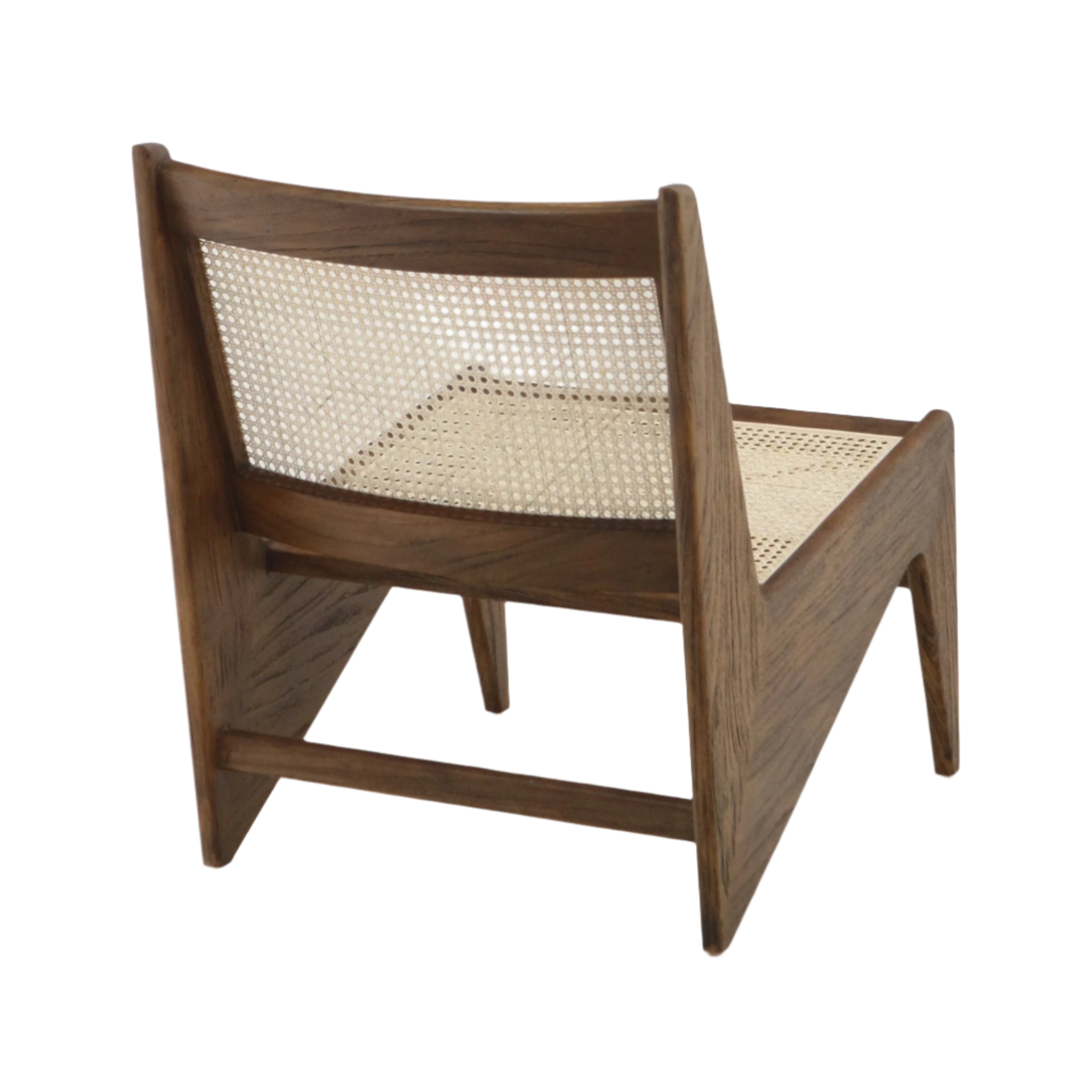Rear three-quarter view of a mid-century modern low lounge chair in warm teak with solid wood frame and woven natural cane seat and back, armless profile and tapered angled legs.