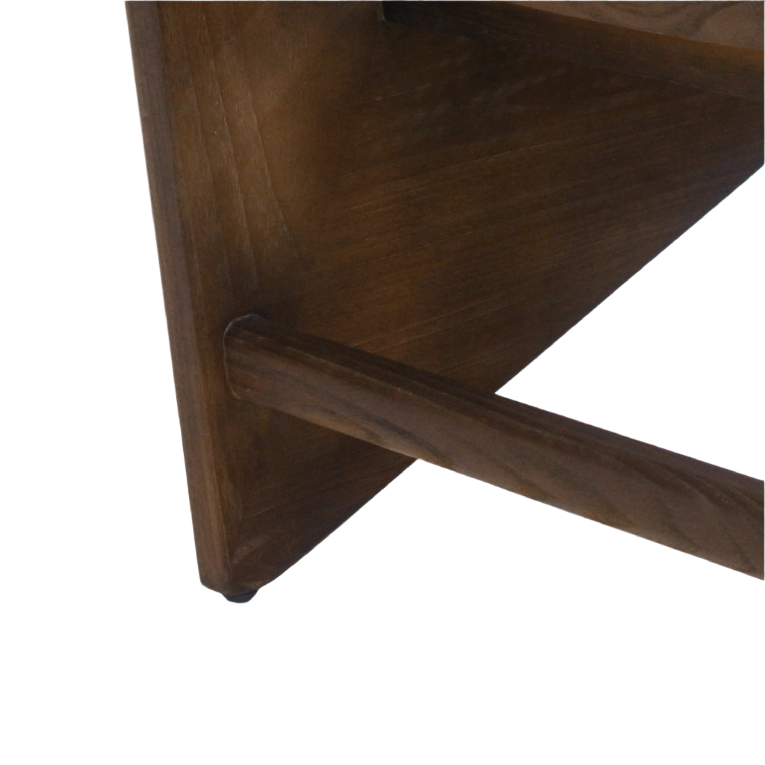 Close-up of a solid teak chair showing a walnut-brown triangular leg and rounded stretcher joint, highlighting smooth wood grain and mid-century modern angled detailing.