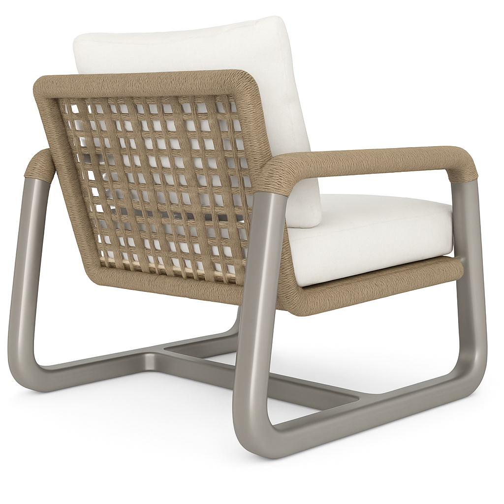 Rear three-quarter view of a coastal outdoor accent chair with a brushed aluminum sled frame, beige woven rope back and wrapped arms, and plush off-white seat and back cushions.