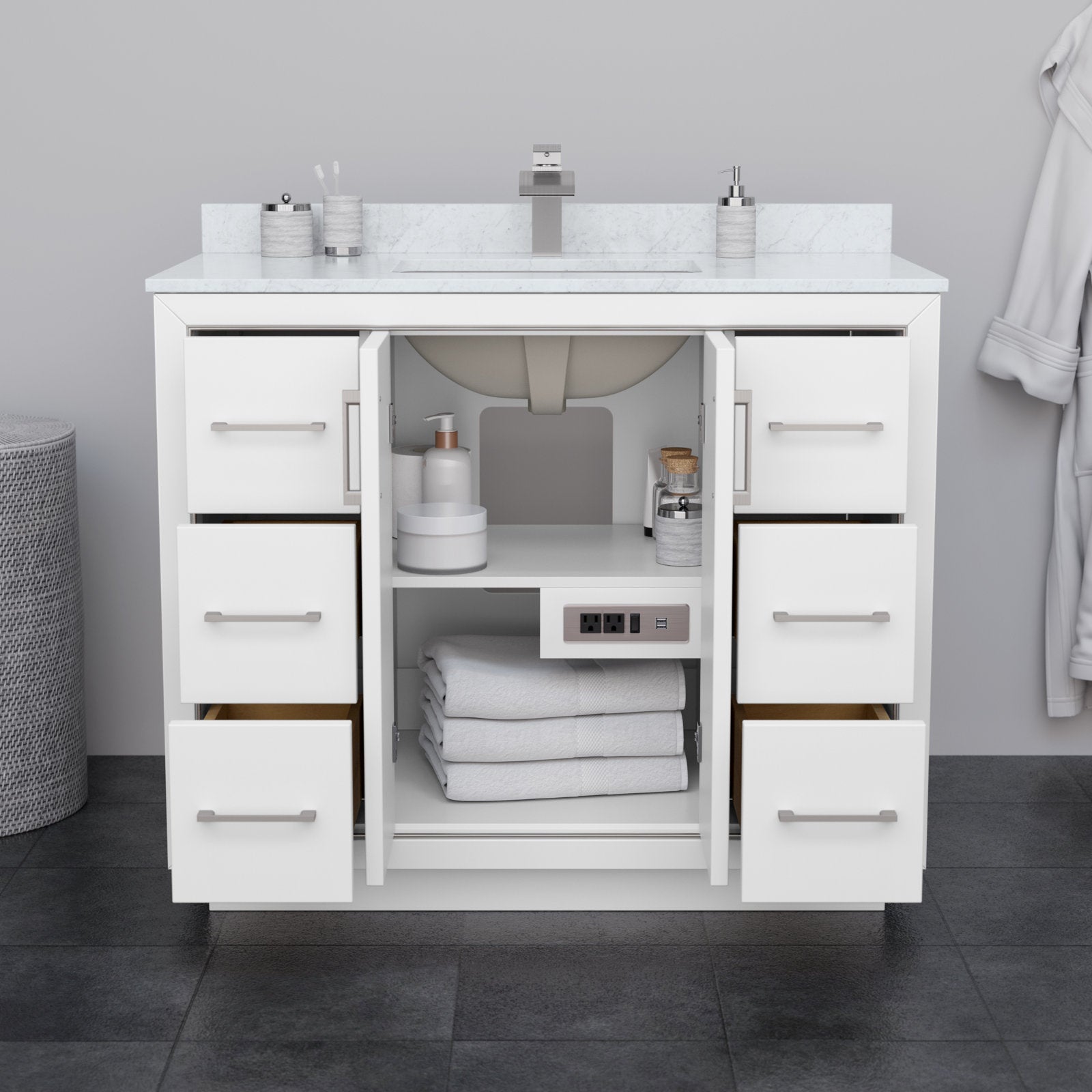 42-inch modern solid wood bathroom vanity in stone finish with a marble-look stone top and integrated ceramic sink, six drawers with brushed metal pulls, open center cabinet with folded towels, toiletries and built-in outlet.