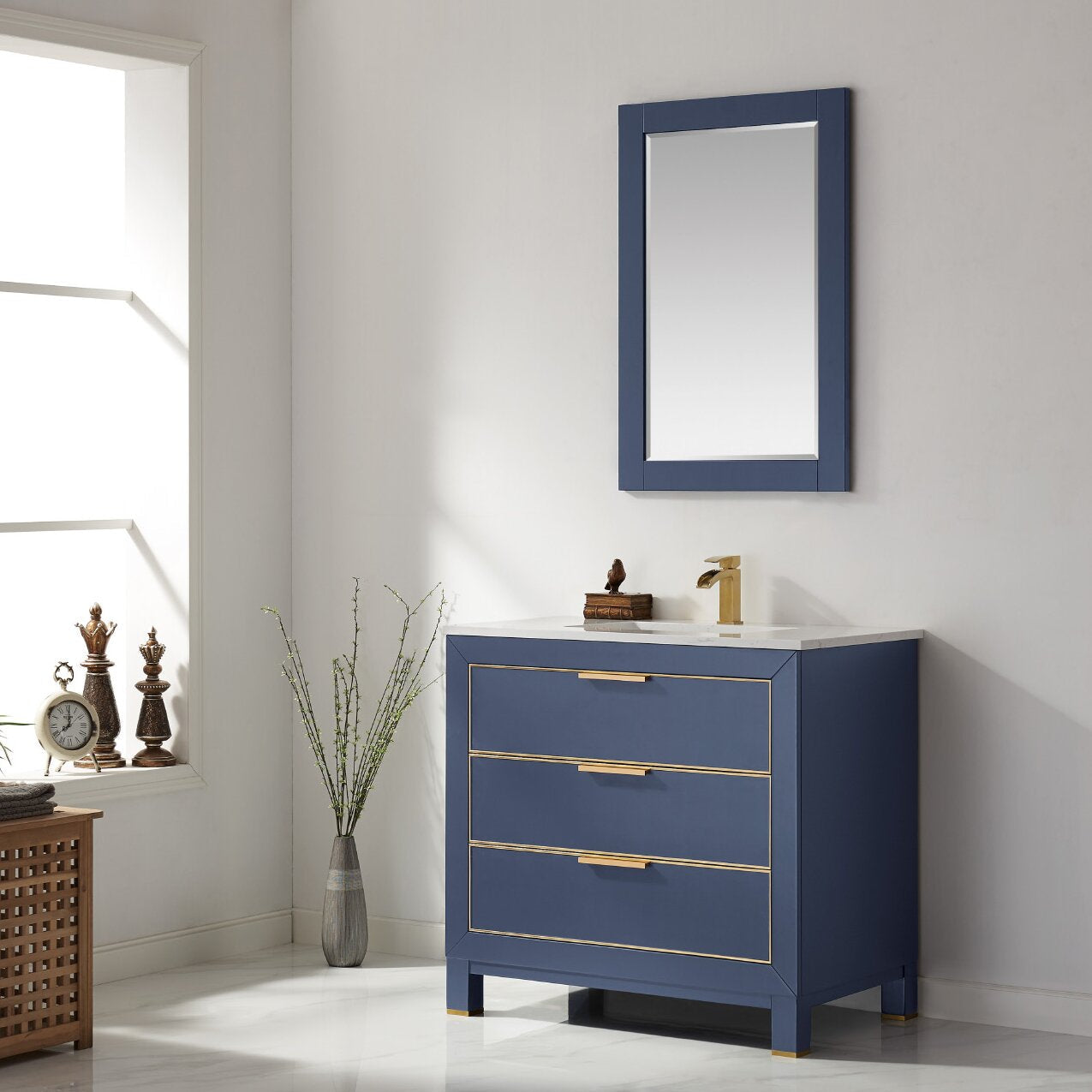 36-inch modern solid wood bathroom vanity in stone finish with a white stone top, three soft-close drawers and gold-tone hardware, shown with a matching wall mirror and brass faucet.