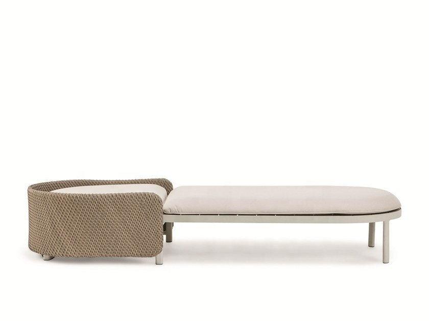 Coastal-style sun lounger with a rounded natural-tone rope-wrapped headrest and a beige outdoor-fabric cushion on a light metal frame with round legs.