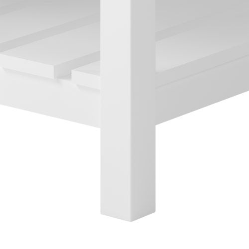 Close-up of a white painted solid wood vanity leg and adjacent slatted lower shelf, highlighting the smooth finish and clean modern lines of the freestanding bathroom vanity.