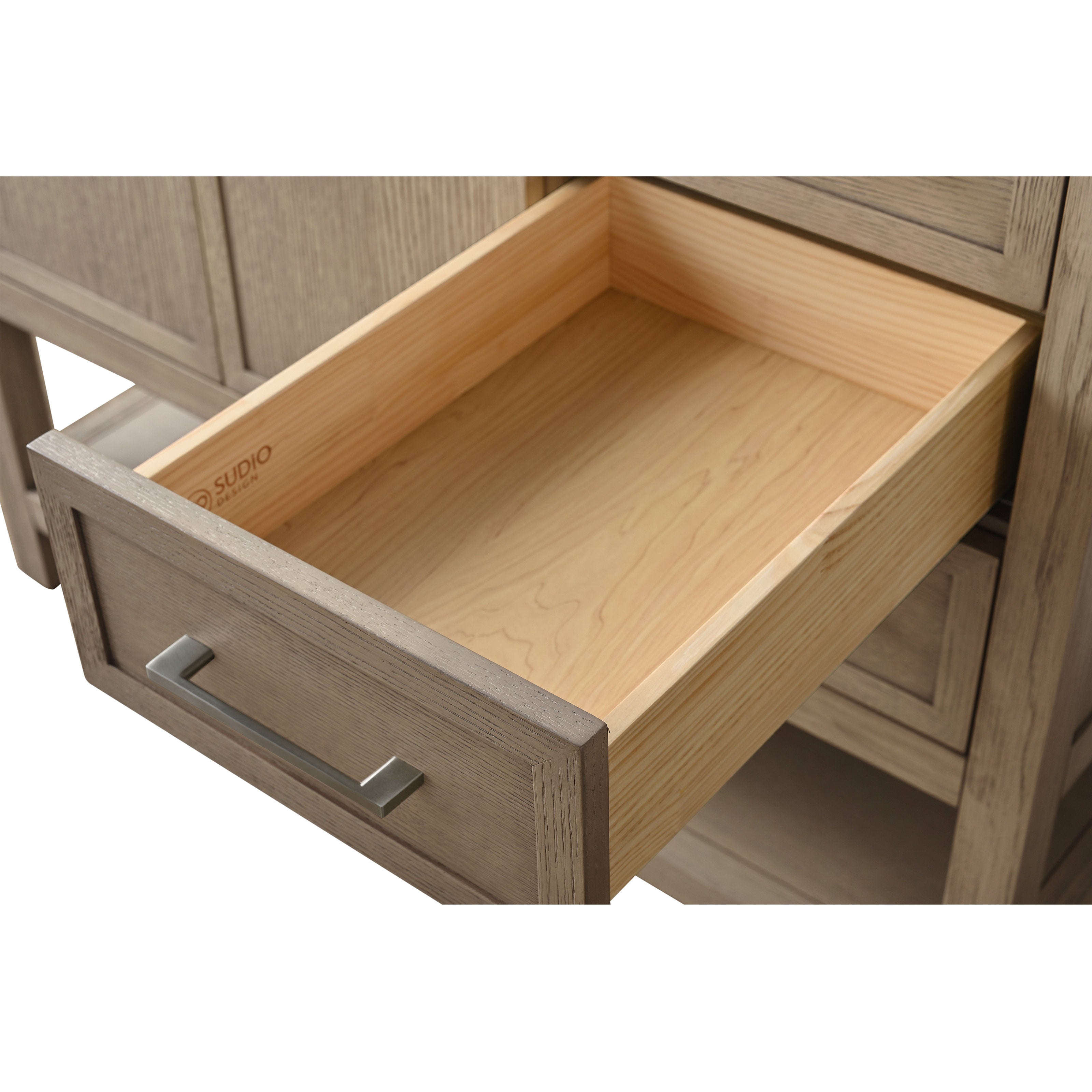 Close-up of an open bathroom vanity drawer showing a light solid-wood interior and grey-stained wooden front with a rectangular brushed-metal pull, highlighting the wood grain and clean joinery.