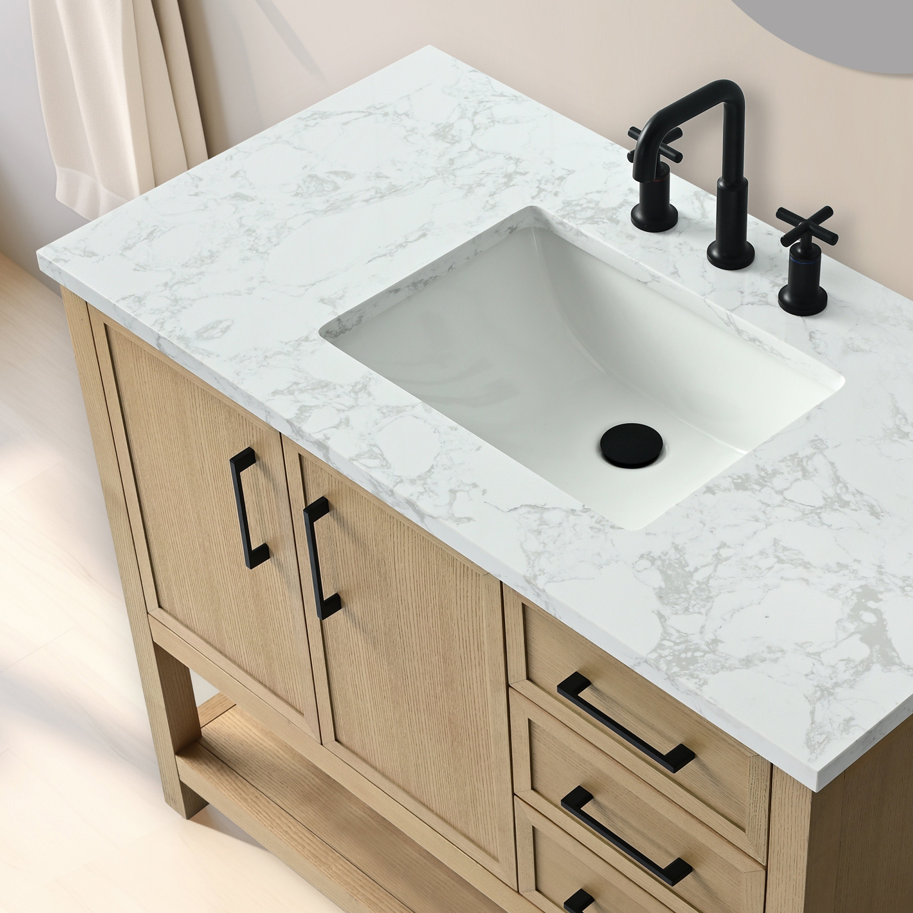 Top-down view of a 42-inch solid wood bathroom vanity with a white marble-pattern stone countertop, rectangular white ceramic sink, matte black faucet and cross handles, black drain cover and matching black pulls.