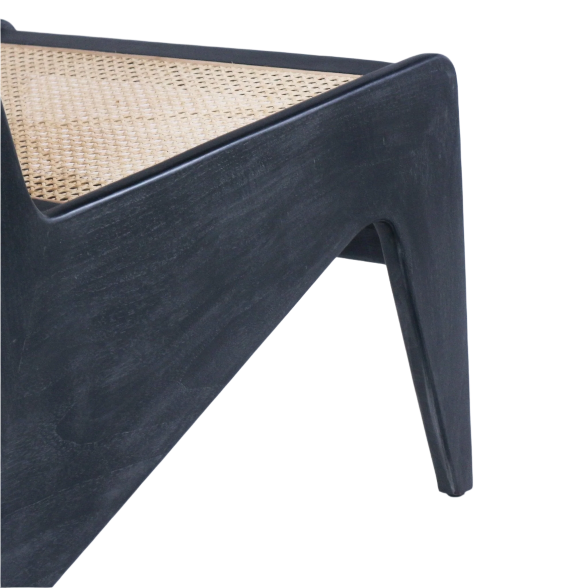Close-up of a black-stained teak chair frame and tapered leg highlighting the woven natural cane seat inset and triangular support detail.