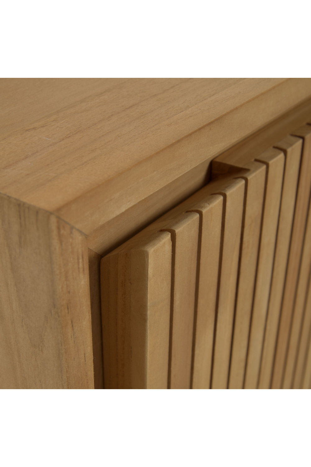 Close-up of a modern stone-colored solid wood vanity corner showing vertical slatted front panels, rounded edge detail, and natural wood grain.