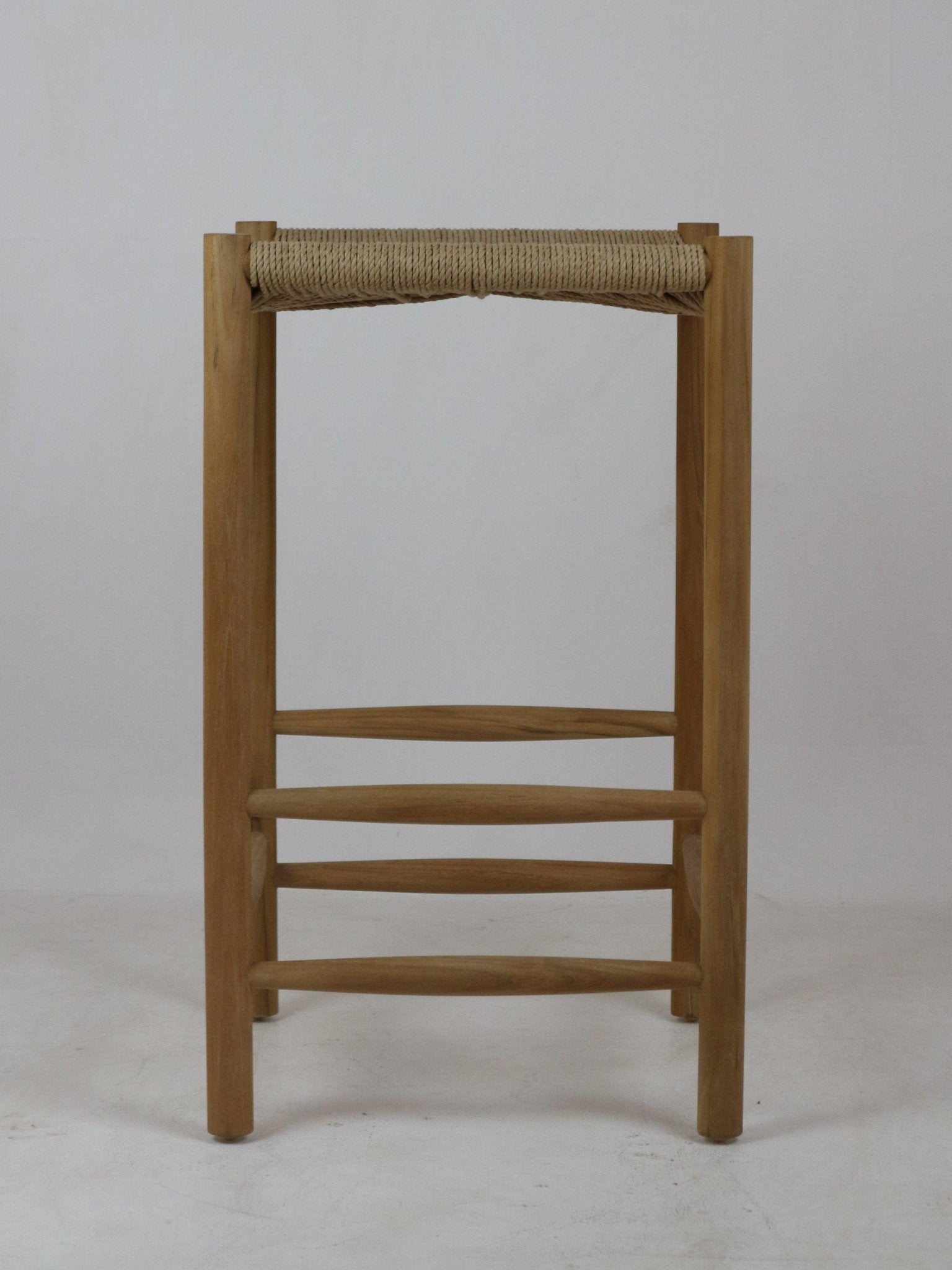 Front view of a natural solid wood backless bar stool with a woven rope seat, rounded legs and three horizontal stretchers in a minimalist modern style.