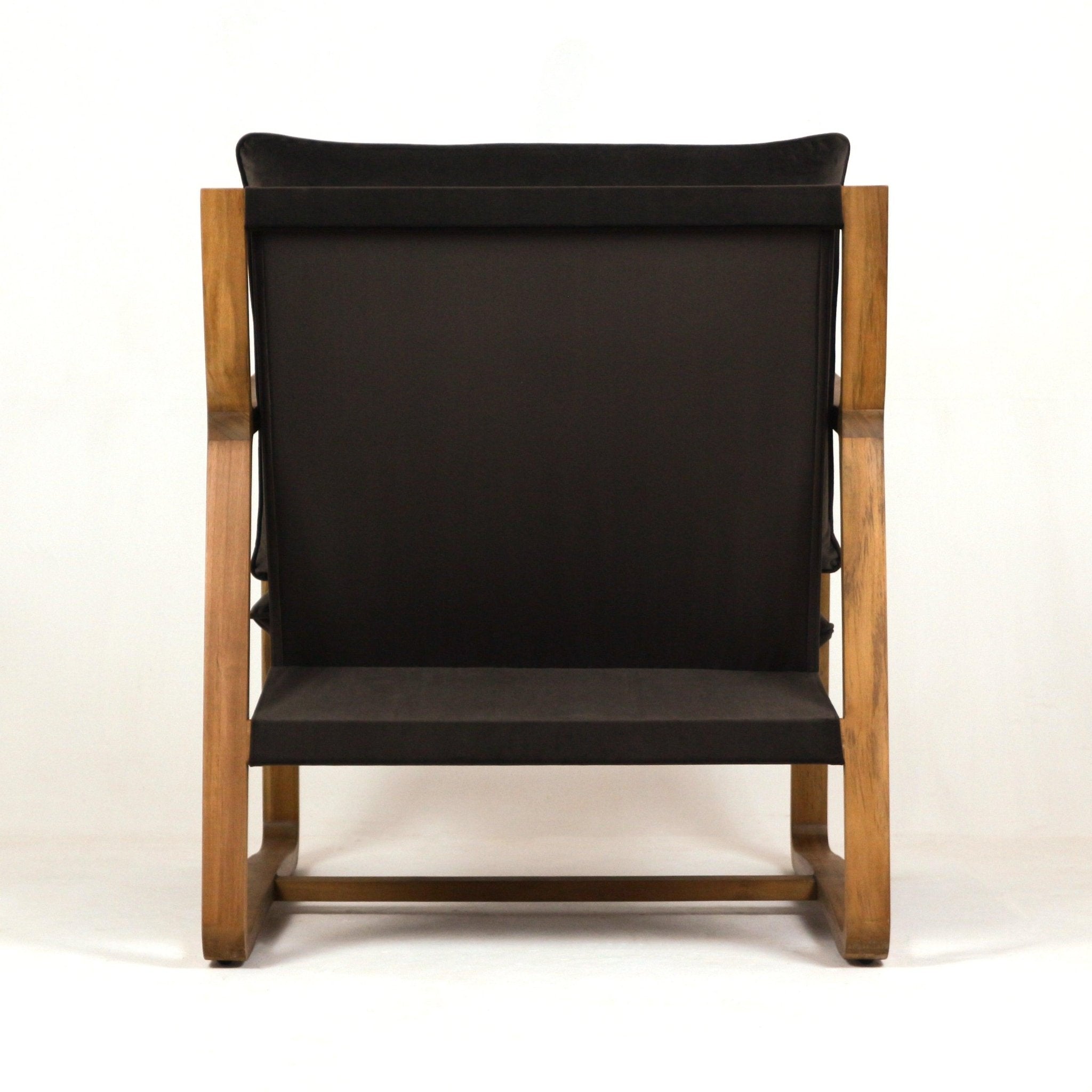 Back view of a mid-century modern accent chair featuring a solid oak frame and dark olive-green velvet upholstery with a low-profile seat and exposed wooden legs.
